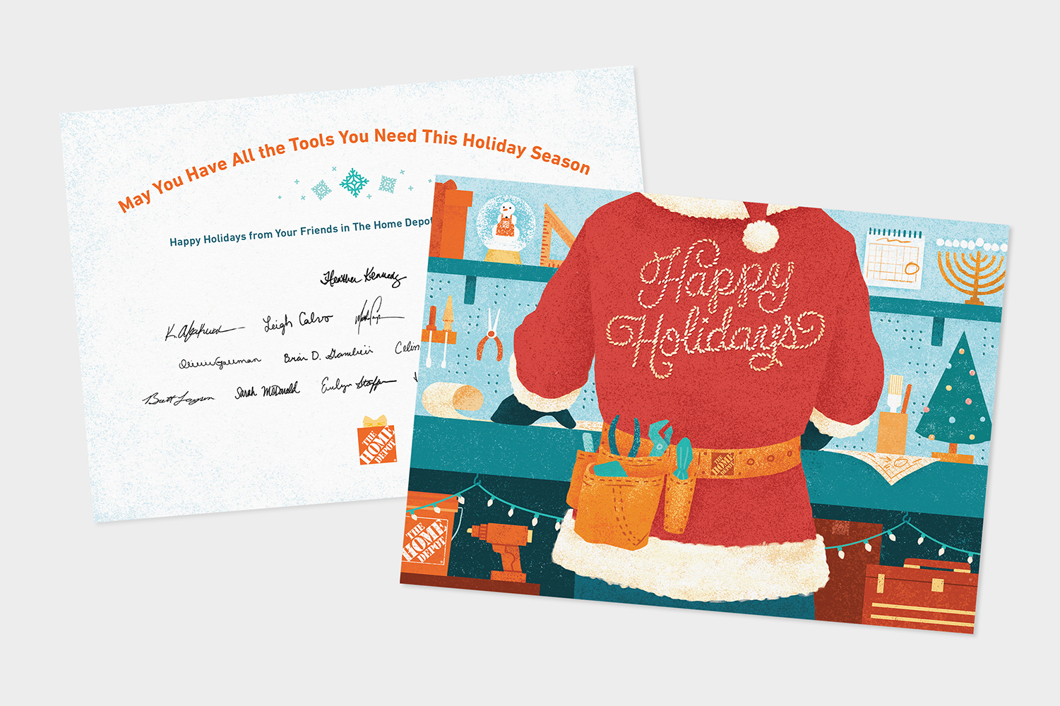 A holiday card featuring a red Santa suit with "Happy Holidays" written on it in glitter. The background displays various workshop tools. The top of the card reads, "May You Have All the Tools You Need This Holiday Season," with signatures below.