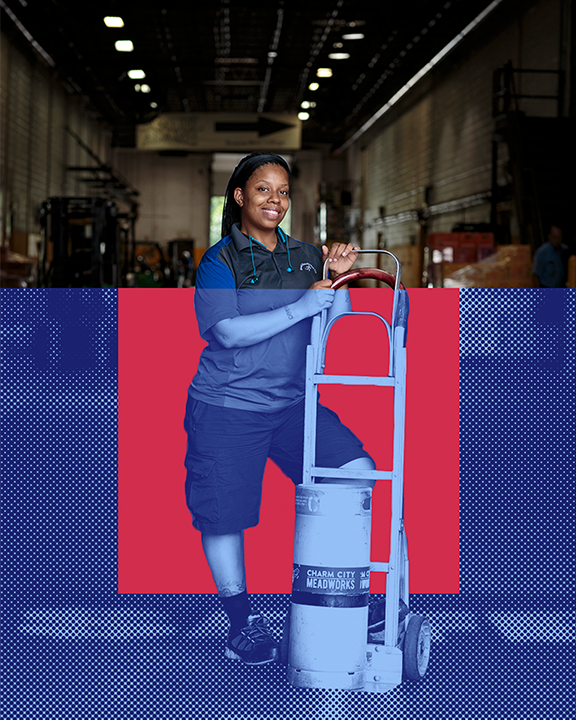 A person wearing a blue uniform stands in a warehouse, leaning on a hand truck. The background features a mix of the actual warehouse and a graphic design element with red and blue colors. The hand truck holds a cylindrical object.