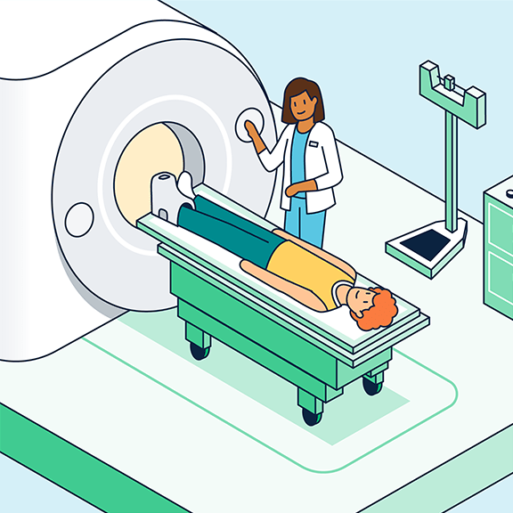 A patient in a yellow shirt is lying down on a medical imaging machine, such as an MRI scanner. A healthcare professional in a white coat is standing beside the machine, adjusting settings. There is a scale and some medical equipment nearby.