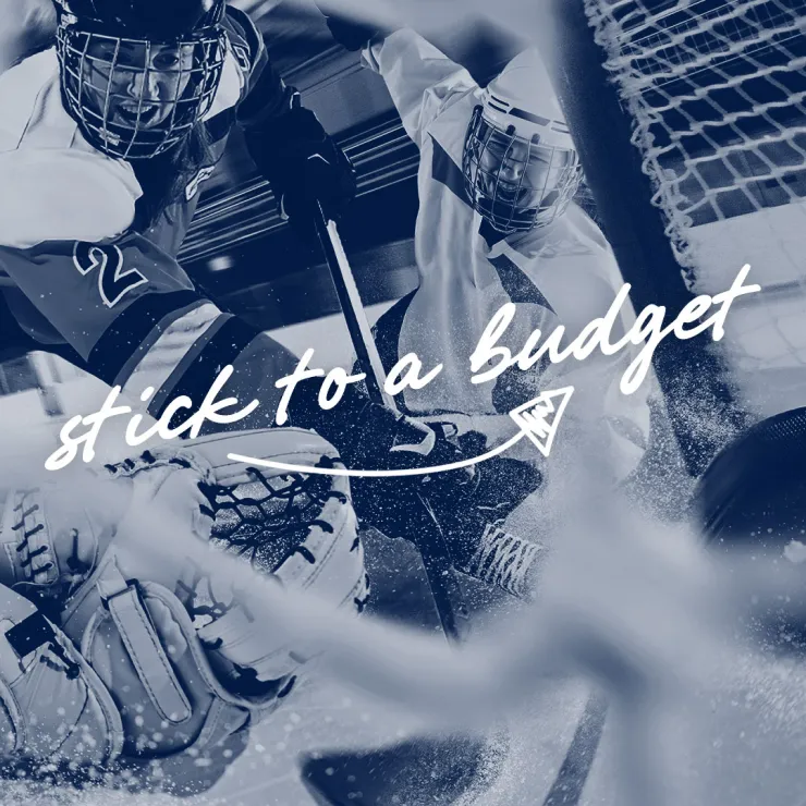 A hockey player in protective gear attempts to score a goal while another player in front of the net tries to block it. The words "stick to a budget" are written across the image with an arrow pointing towards the puck. The image has a blue tint.