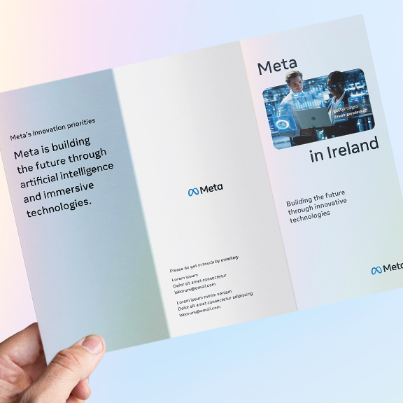 A brochure titled "Meta in Ireland" showcases Meta's innovation priorities in artificial intelligence and immersive technologies. The left side features text, while the right includes an image of two individuals working with VR technology.