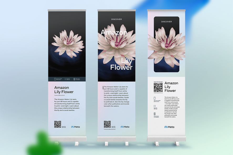 Three roll-up banners feature an image of a white Amazon Lily flower. The text promotes the Amazon Lily and has a QR code at the bottom. The blue and black "Meta" logo appears at the bottom of each banner. The background is subtle with a hint of greenery.