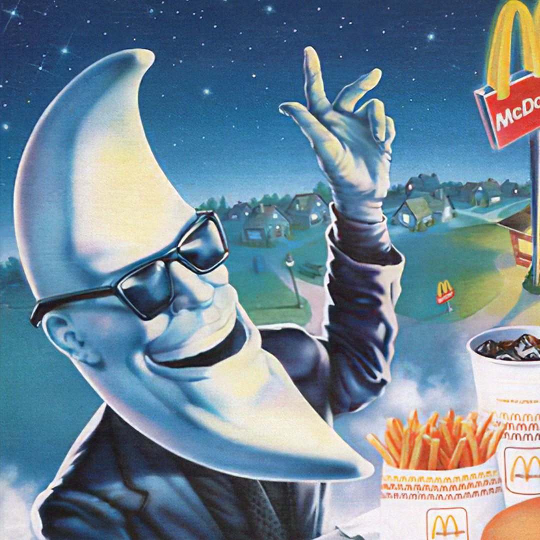 An illustration of a character with a crescent moon-shaped head, wearing sunglasses and a suit, gesturing with one hand. The background features a nighttime suburban scene with a McDonald's sign, as well as fries and a drink in McDonald's packaging in the foreground.