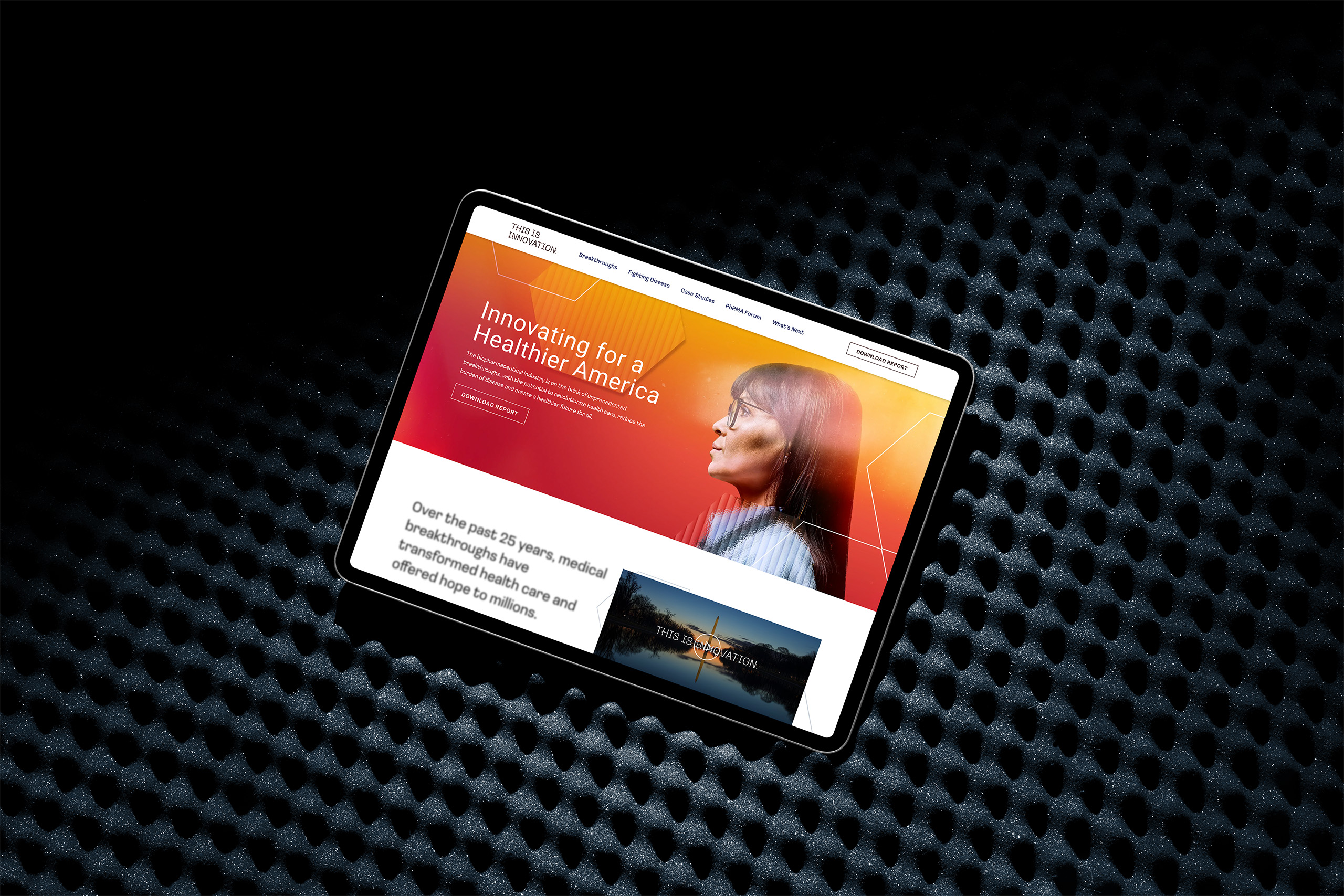 A tablet showcasing a website with the header "Innovating for a Healthier America" sits on a textured, dark surface. The screen features a woman gazing upwards and text about partnerships in healthcare, highlighting an effective communication strategy for health advocacy.